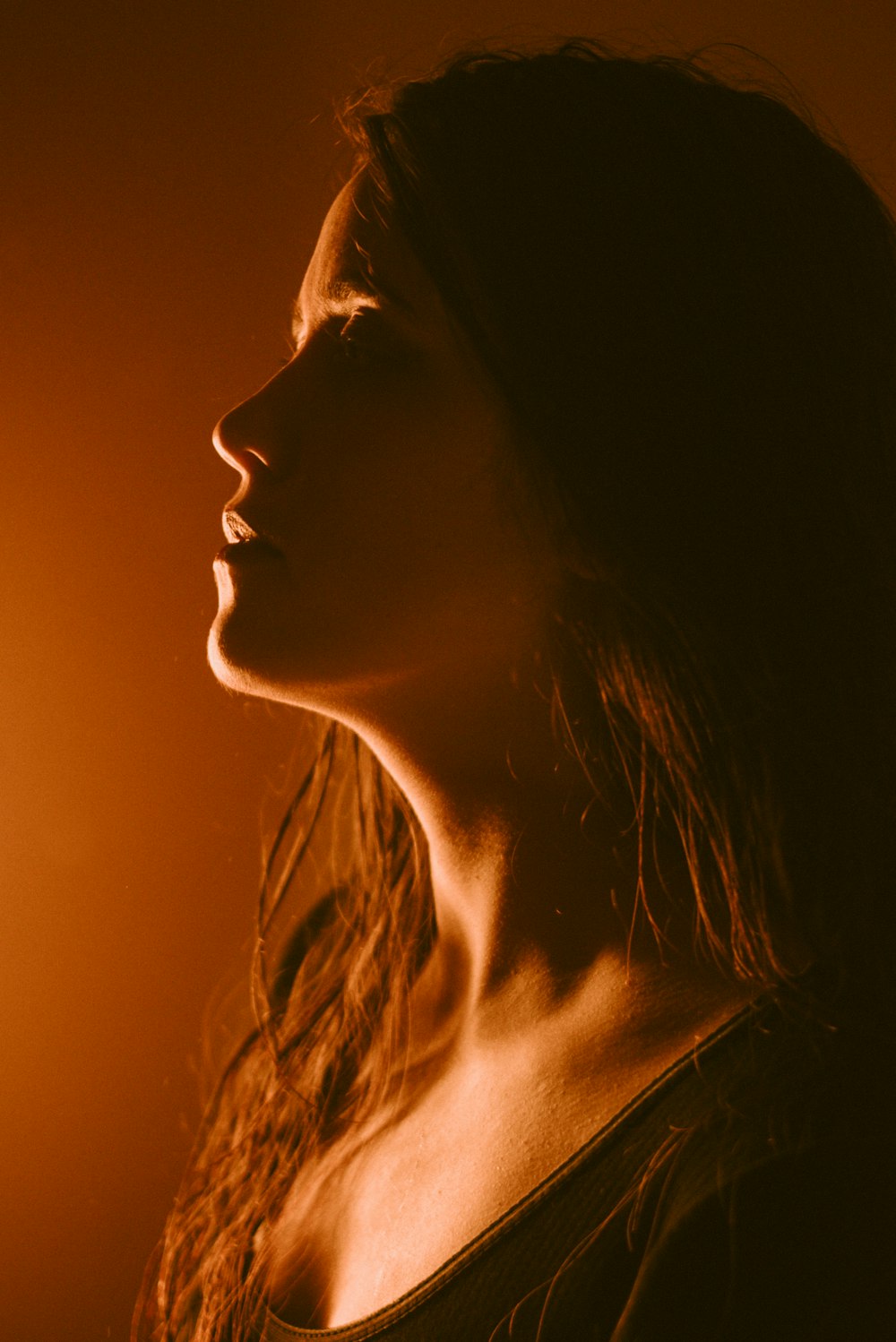 woman with brown hair looking up