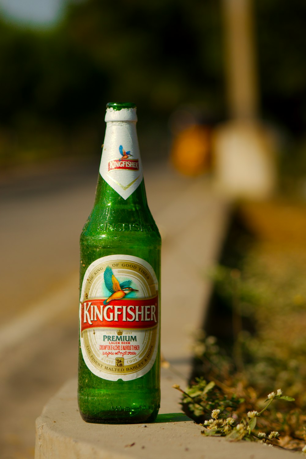 heineken beer bottle on gray concrete floor