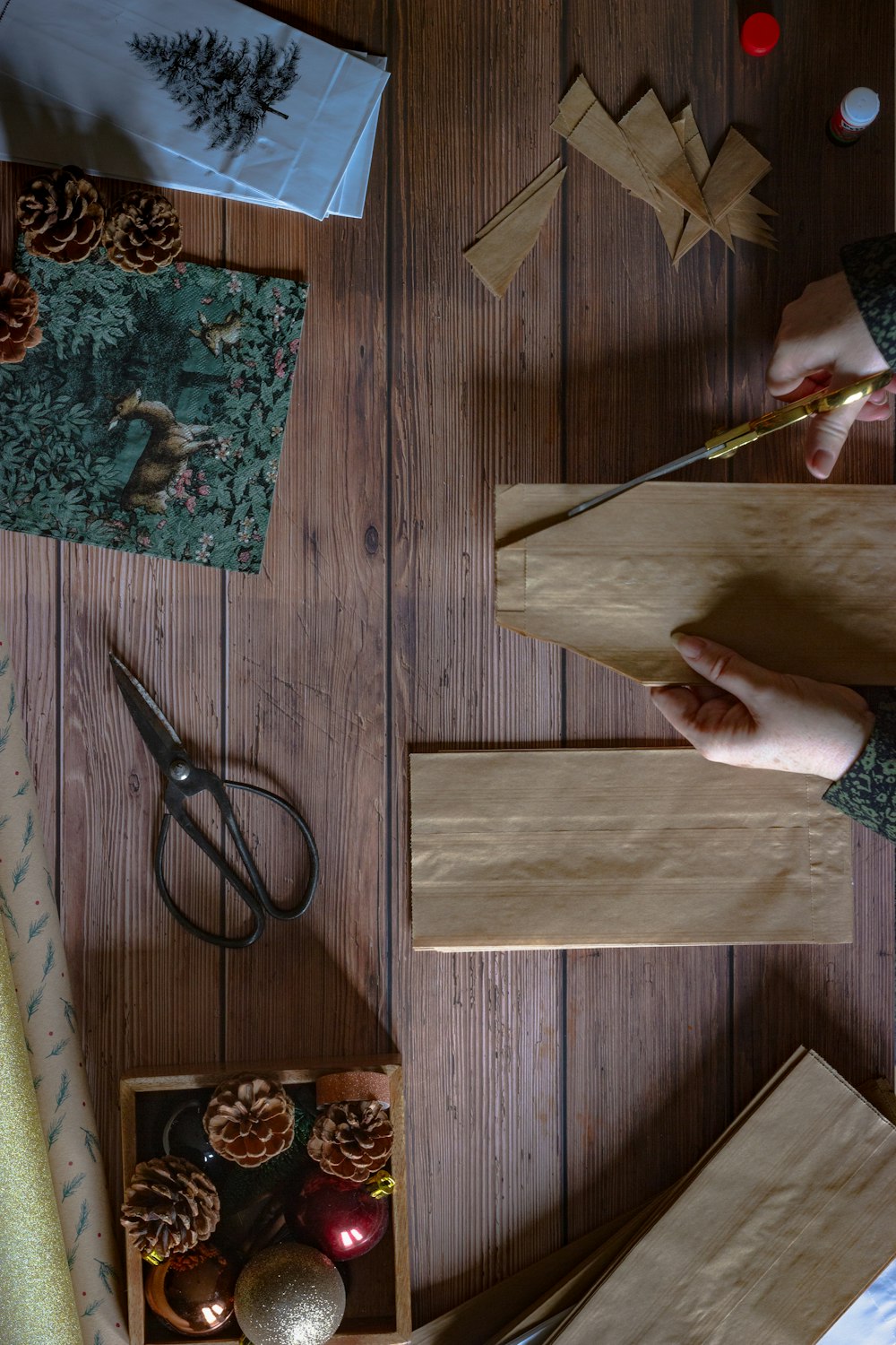 person holding brown wooden board