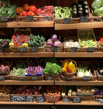 assorted fruits on brown wooden rack