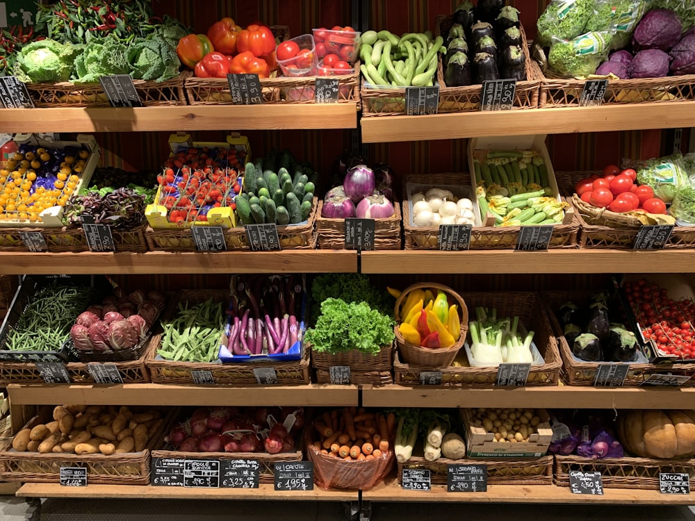 assorted fruits on brown wooden rack