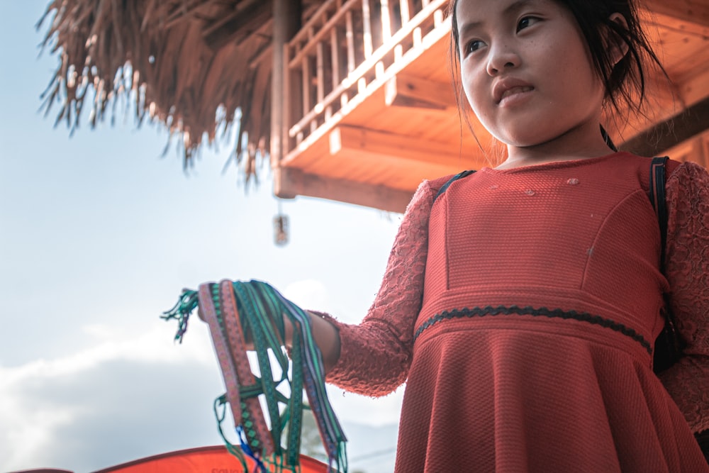 girl in red long sleeve shirt