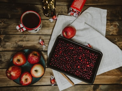 red apple fruit on black tray eve google meet background