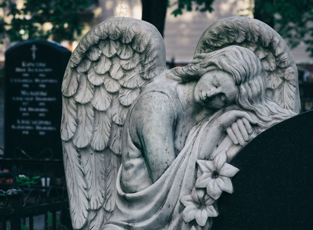 gray scale photo of angel statue