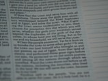 The image contains a close-up section of a book, likely a religious text, with slightly blurred and highlighted text emphasizing the words 'Lord', 'serve', and 'choose'. The text appears structured in paragraphs with some sections indented.