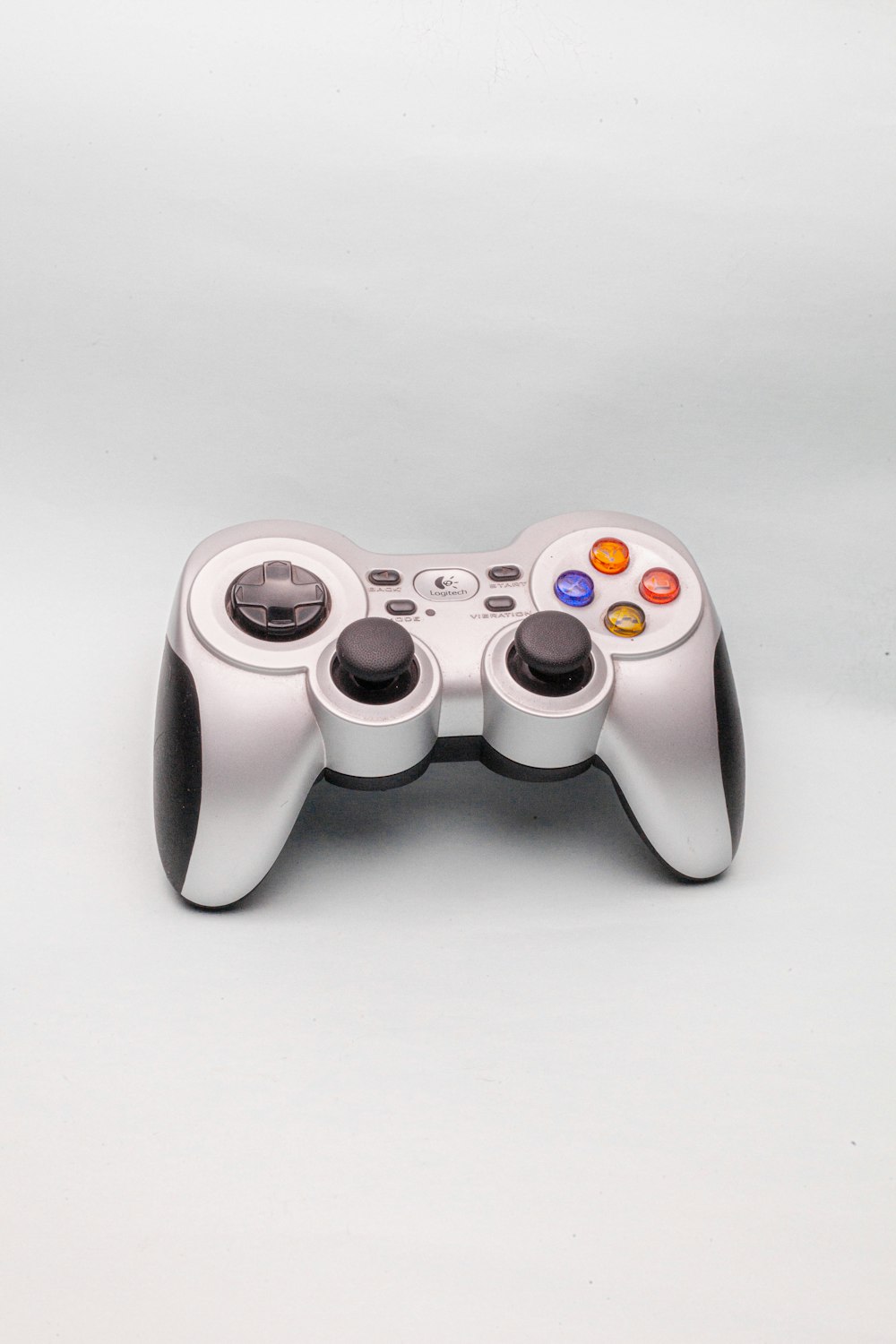 white and black game controller