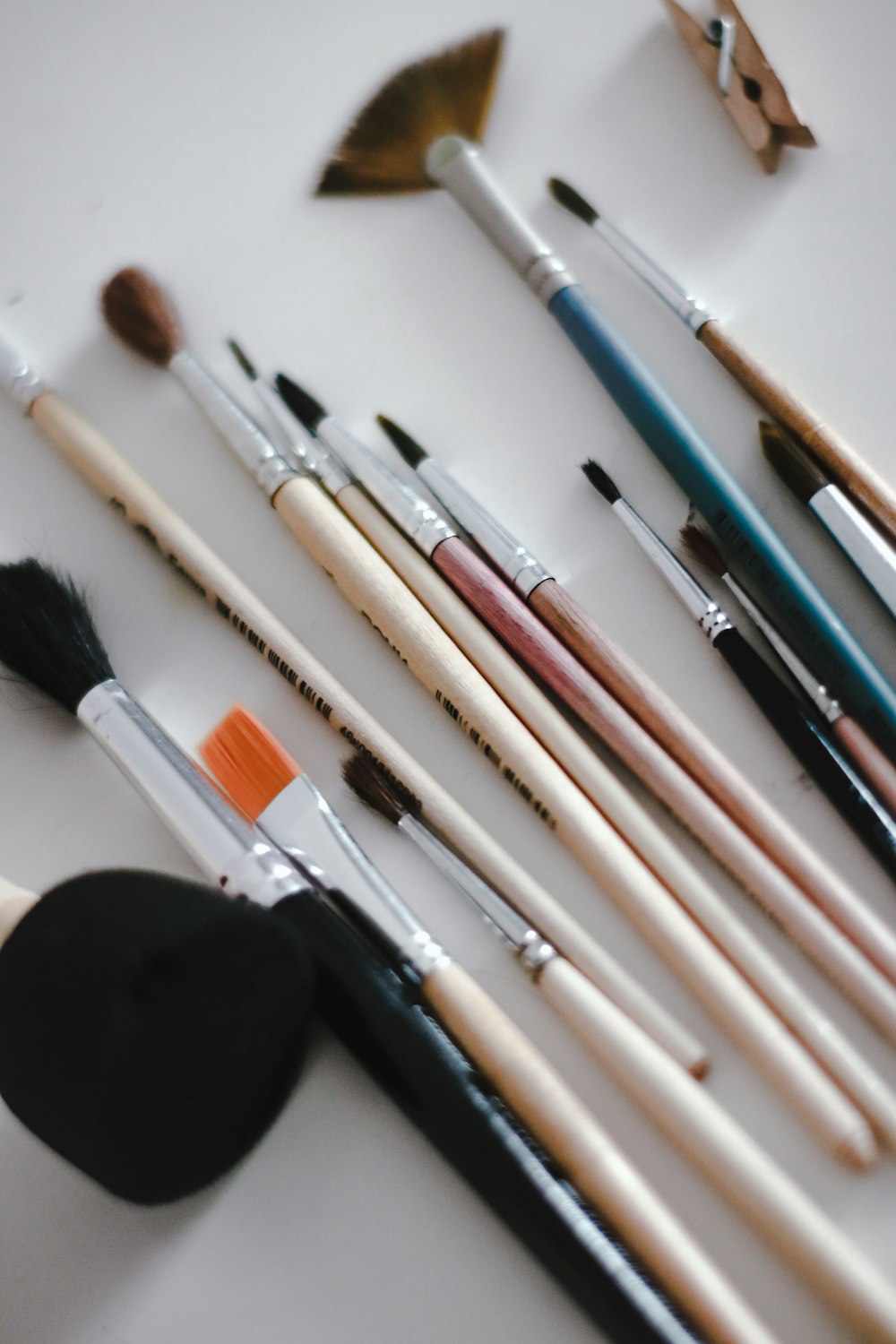 makeup brushes on white table