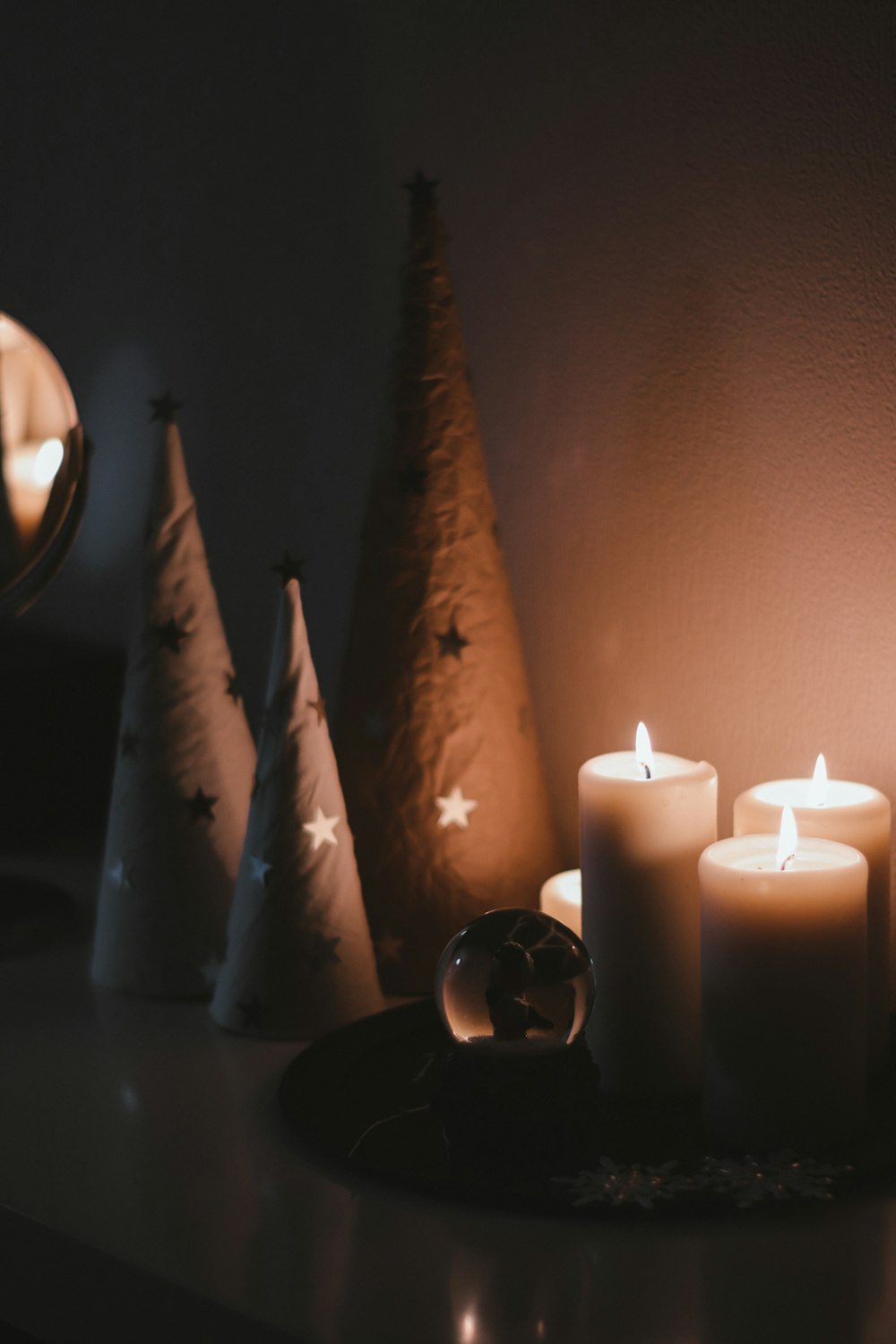 white candles on black steel candle holder