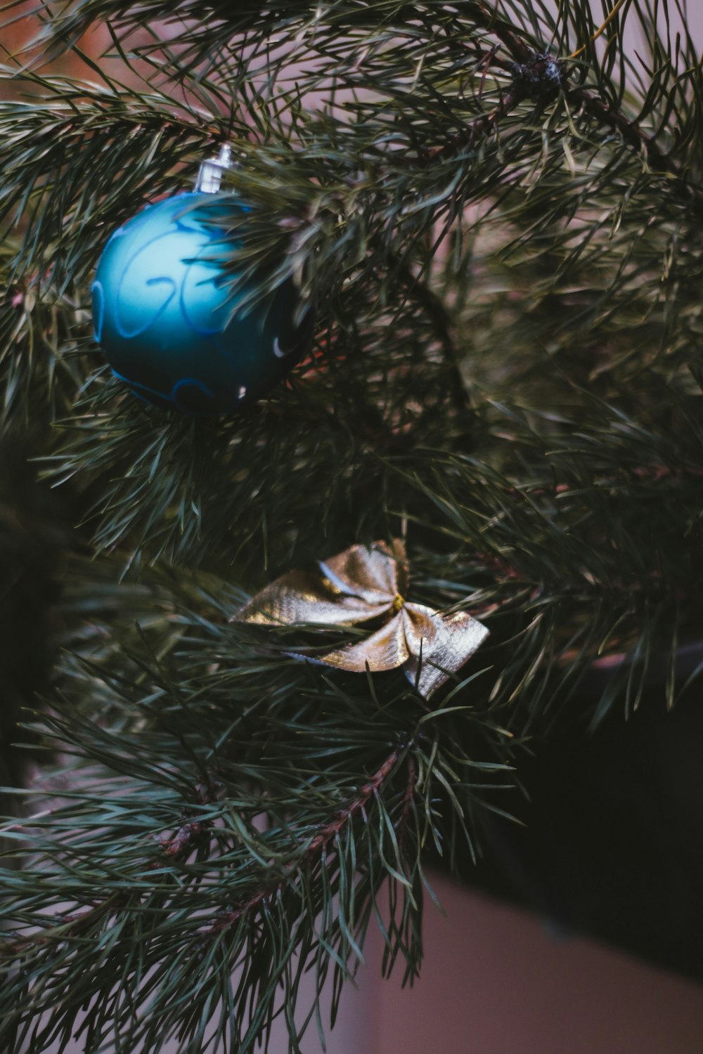 blue bauble on green christmas tree