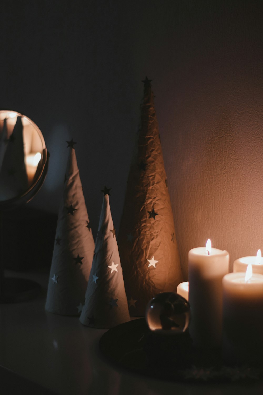 white pillar candles on table