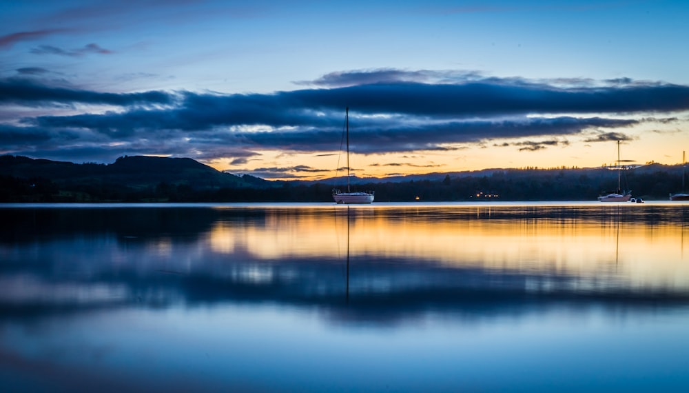 body of water under blue sky during sunset