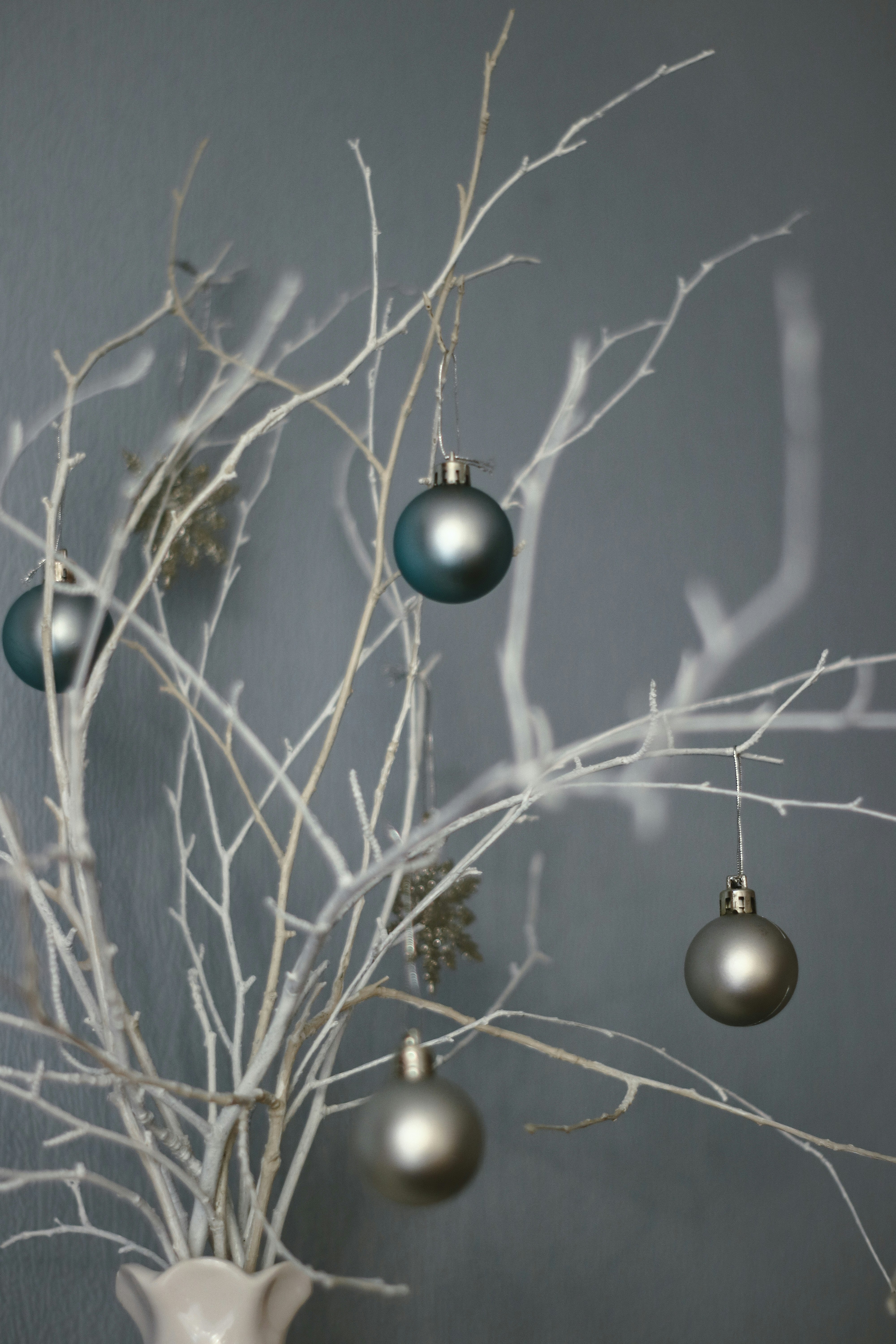 blue and silver baubles on brown tree branch