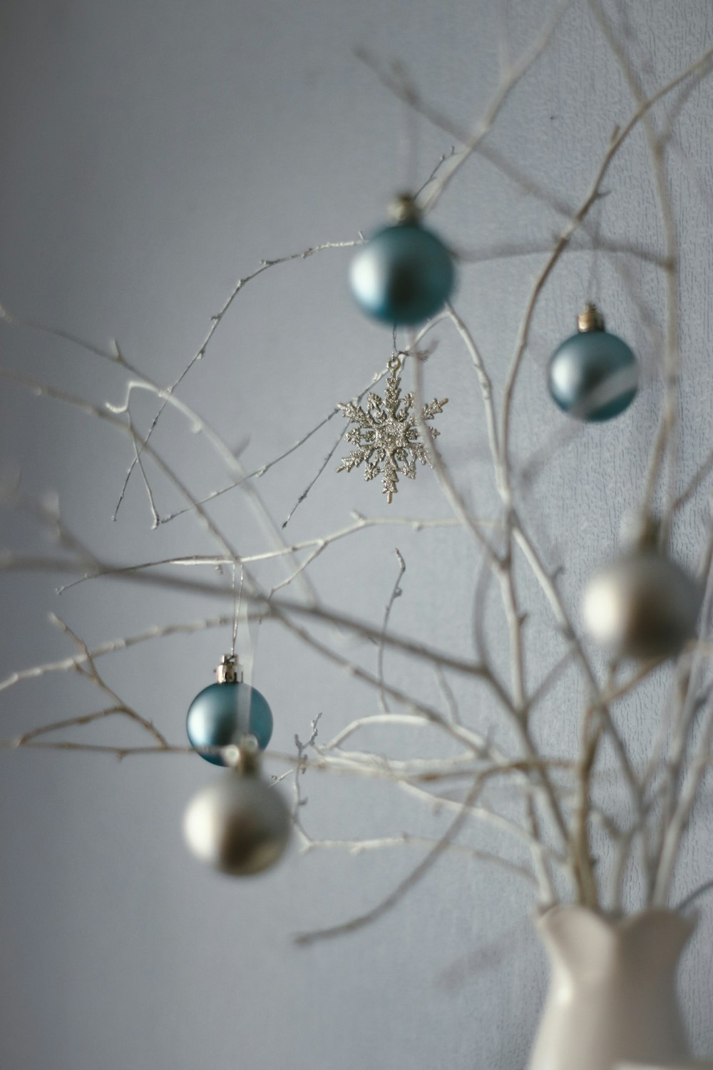 blue and white baubles on tree branch