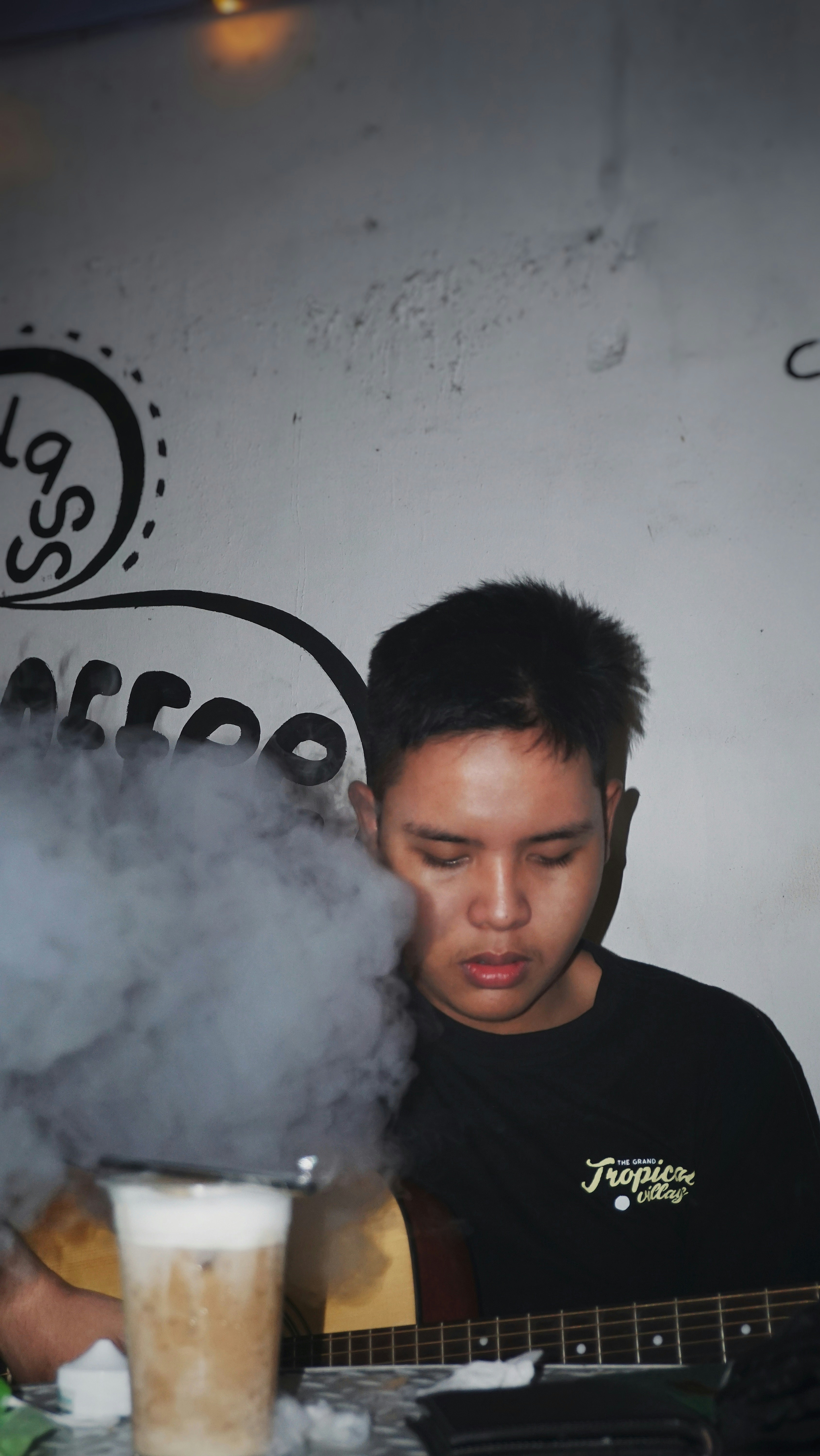 man in black crew neck shirt smoking