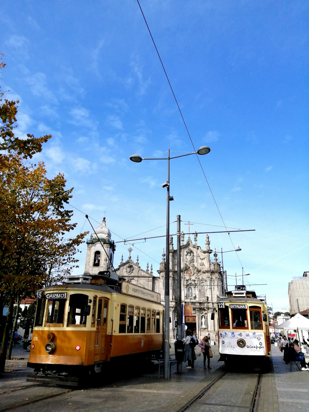 brown and black tram on the street during daytime