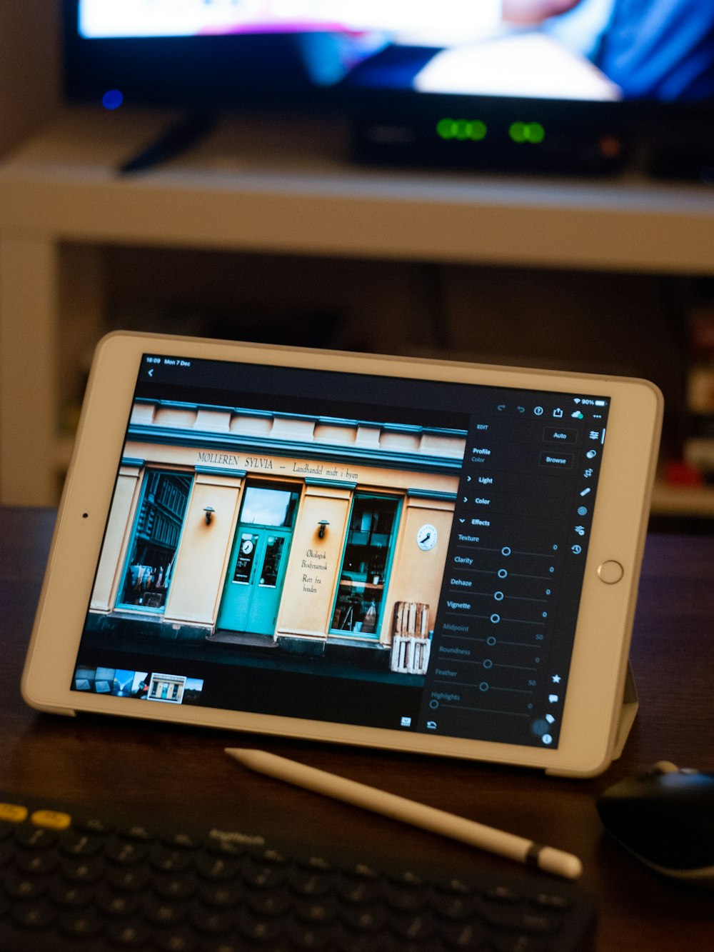 white ipad on brown wooden table