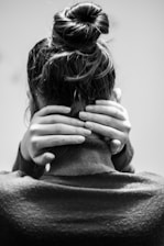 Sore neck waiting for an adjustment. Man holding his neck