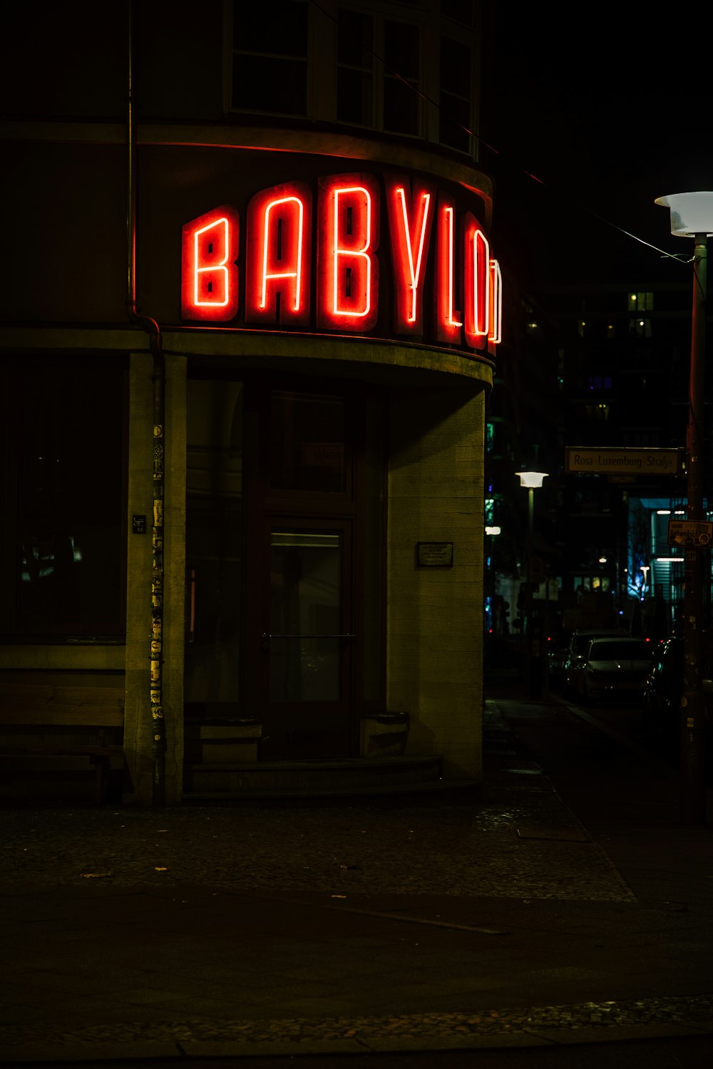 a building with a neon sign on the front of it