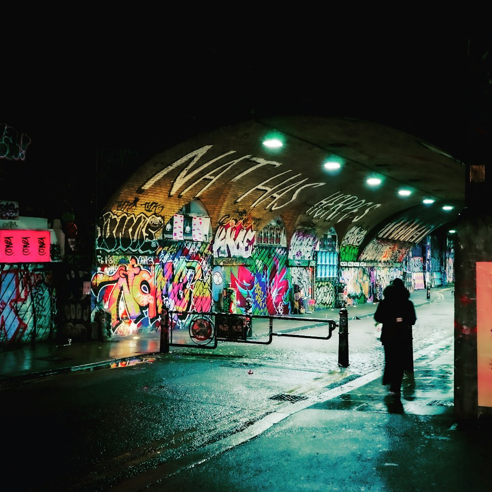 people walking on street during night time