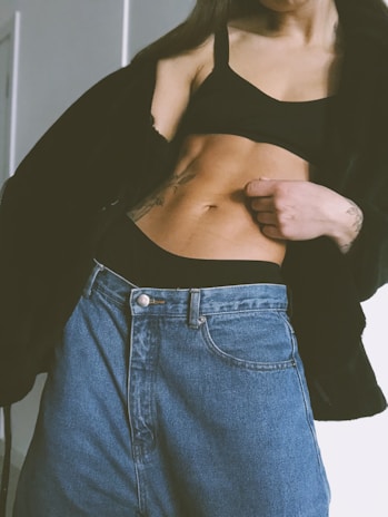 A fitness model wearing a trendy oversized top.