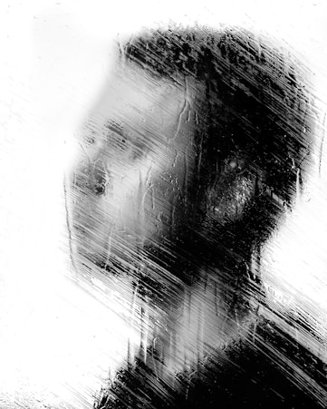 Close-up of a sleek acrylic glass portrait with layered abstract shapes in muted tones.