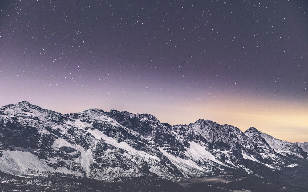 snow covered mountain under blue sky