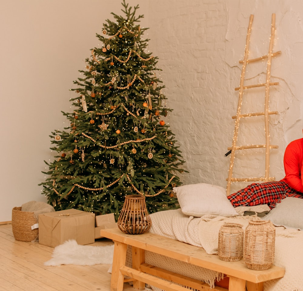 green christmas tree on brown wooden table