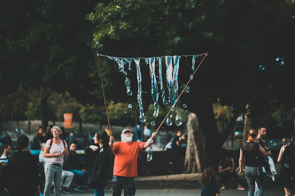 people holding blue and white flag during daytime