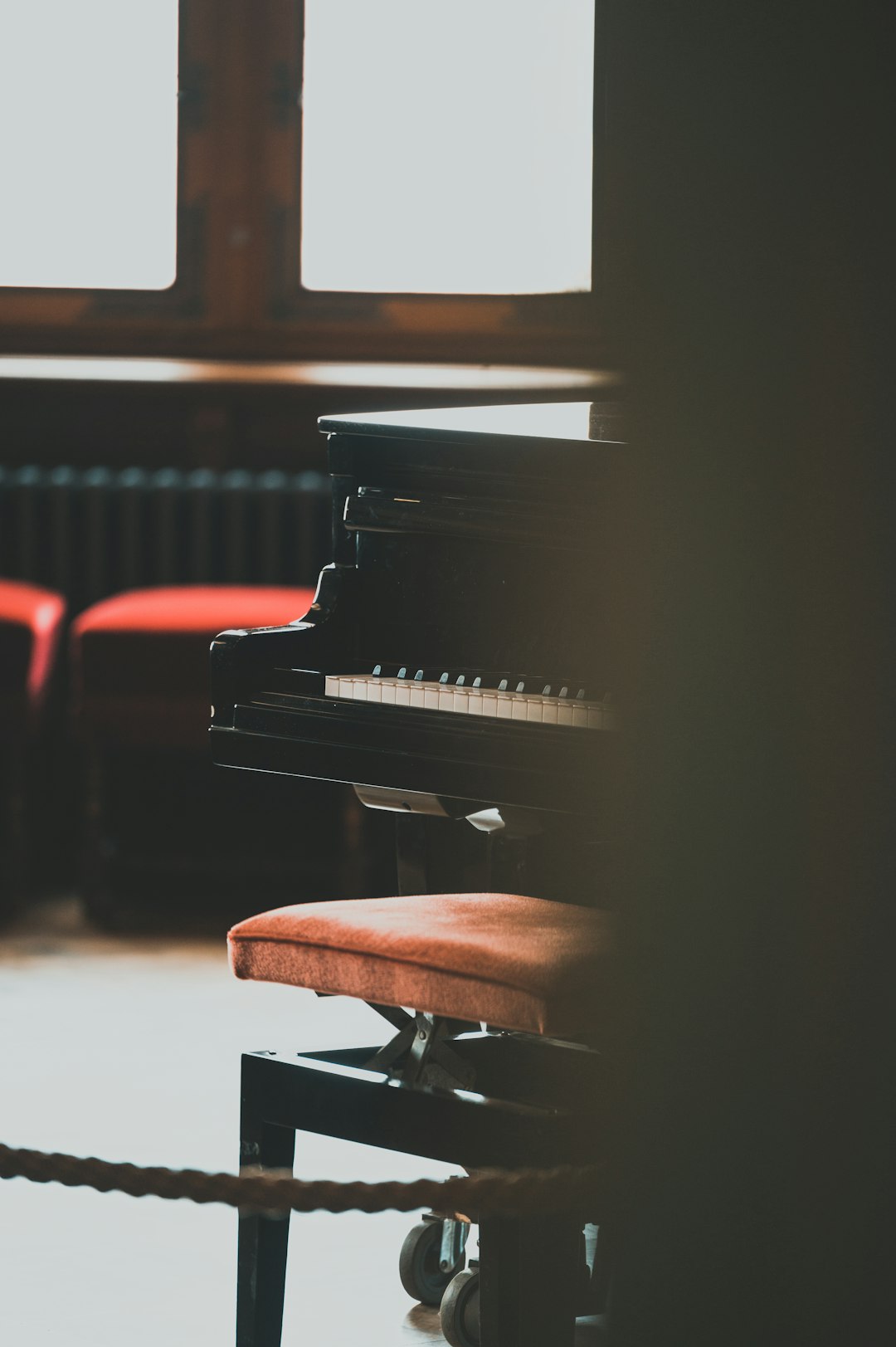 black wooden grand piano in close up photography