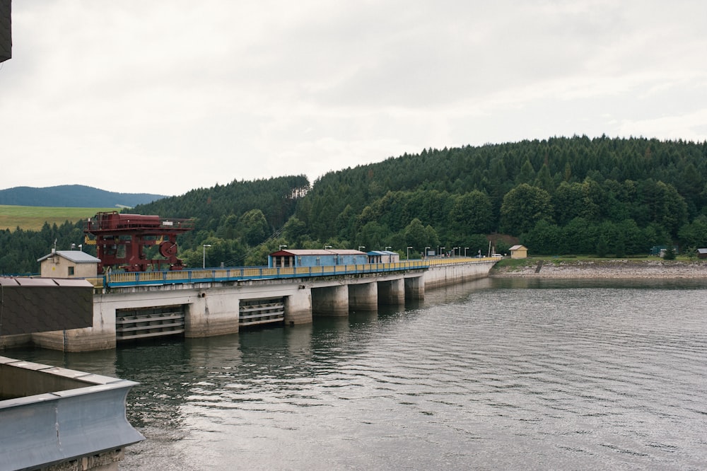 red and white concrete bridge over river