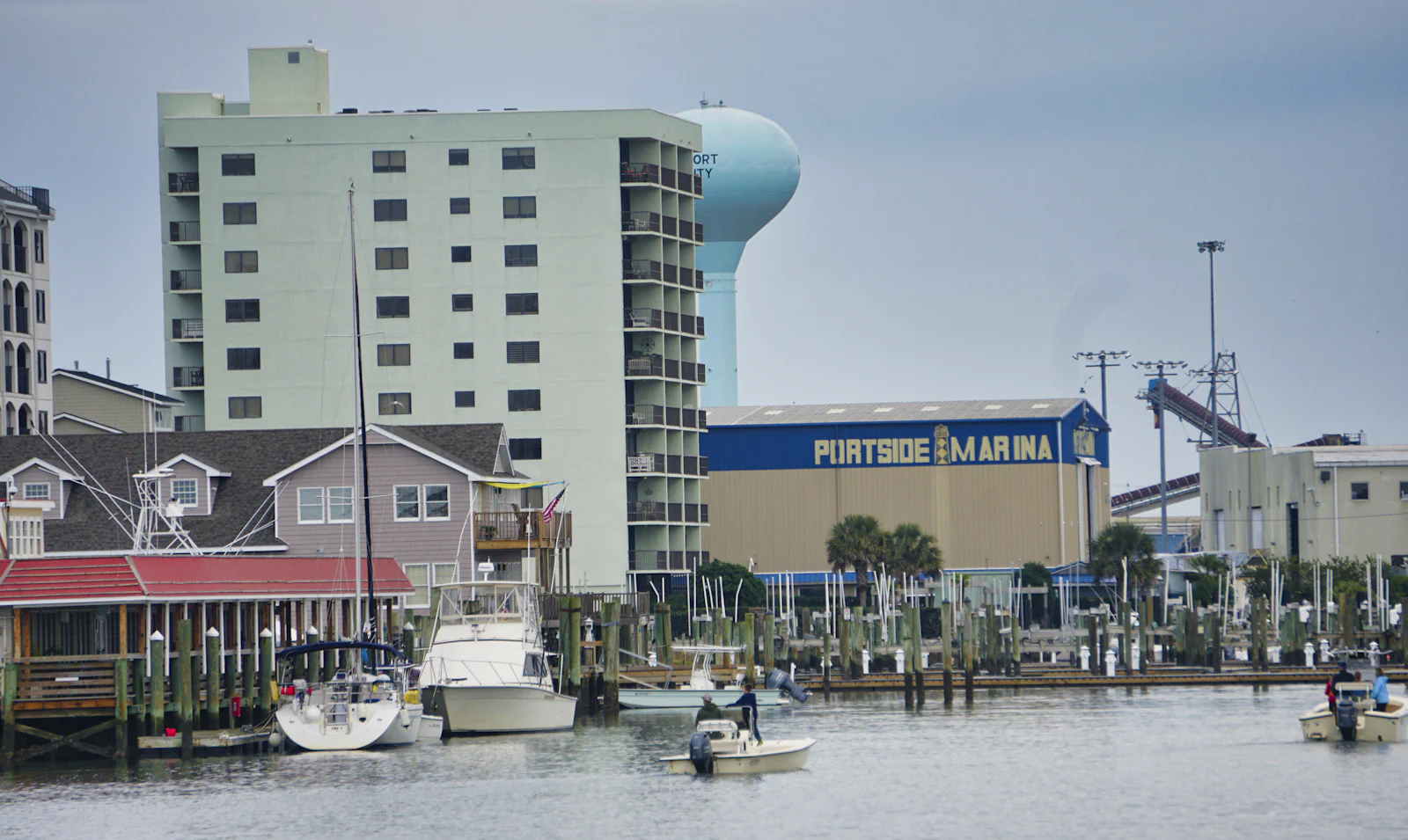 Boats moored at a waterfront marina