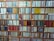 A close-up of colorful stationery items neatly arranged on a shelf.