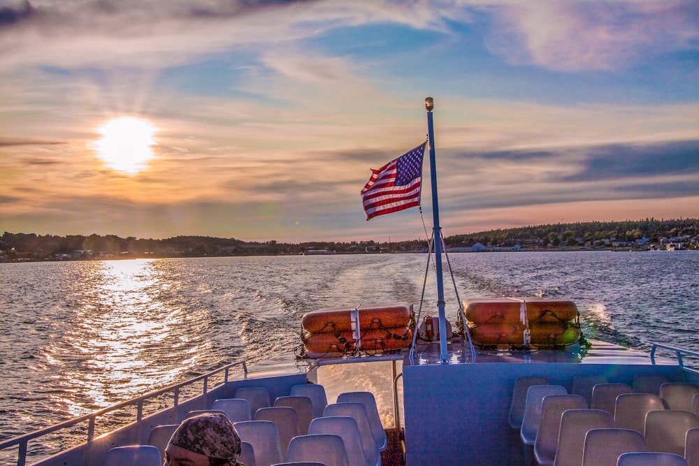 us a flag on boat on sea during daytime