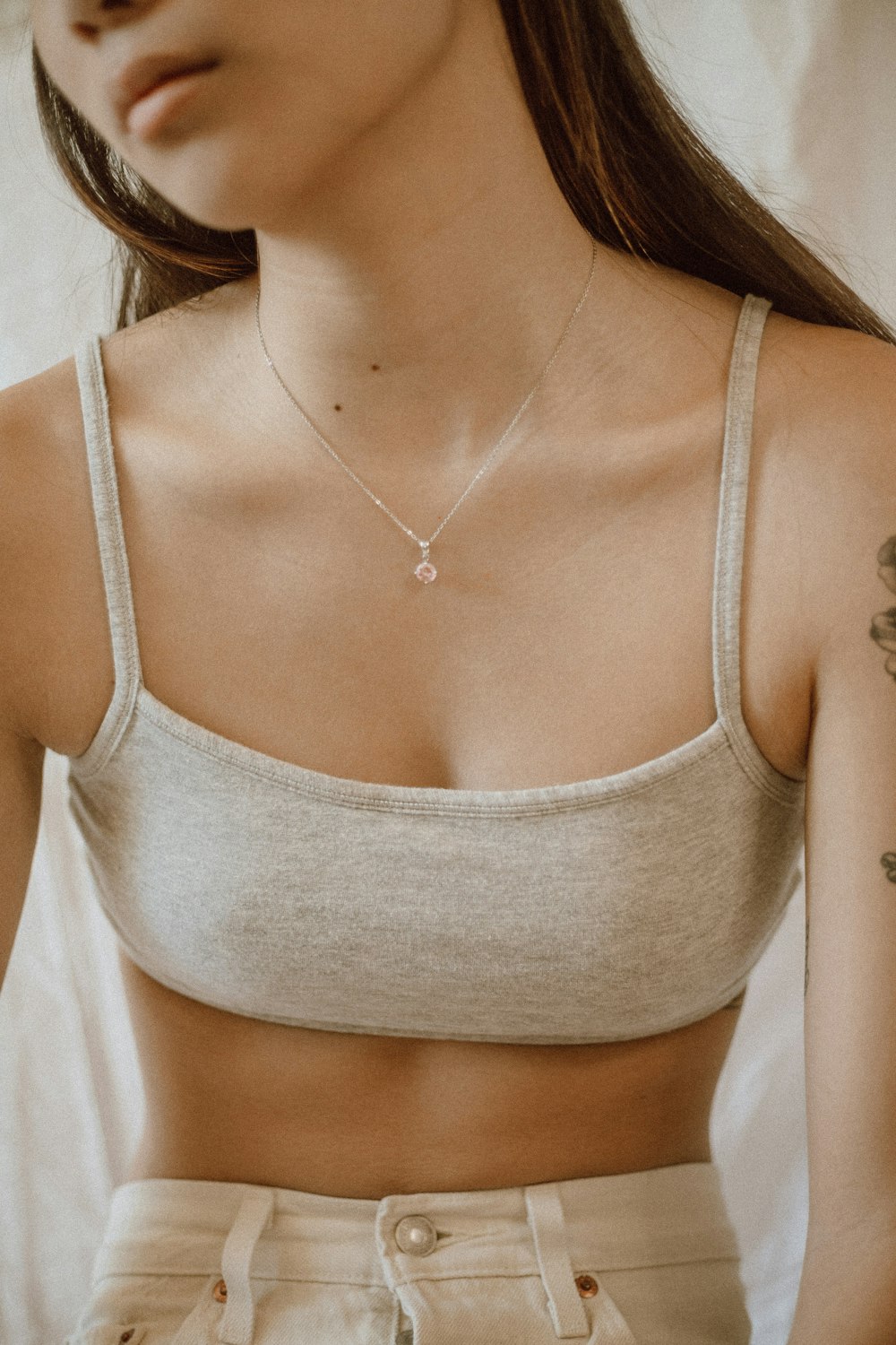 woman in gray sports bra