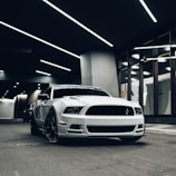 white bmw m 3 parked in garage