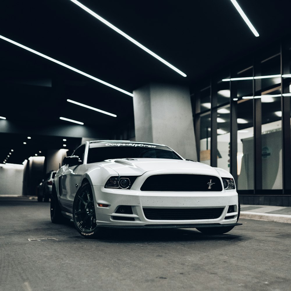 white bmw m 3 parked in garage