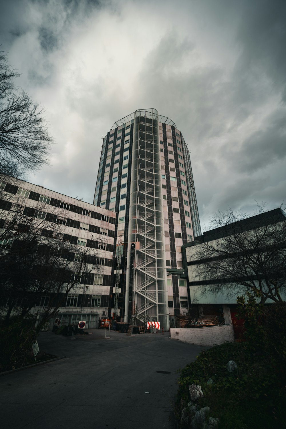 cars parked near high rise building during daytime