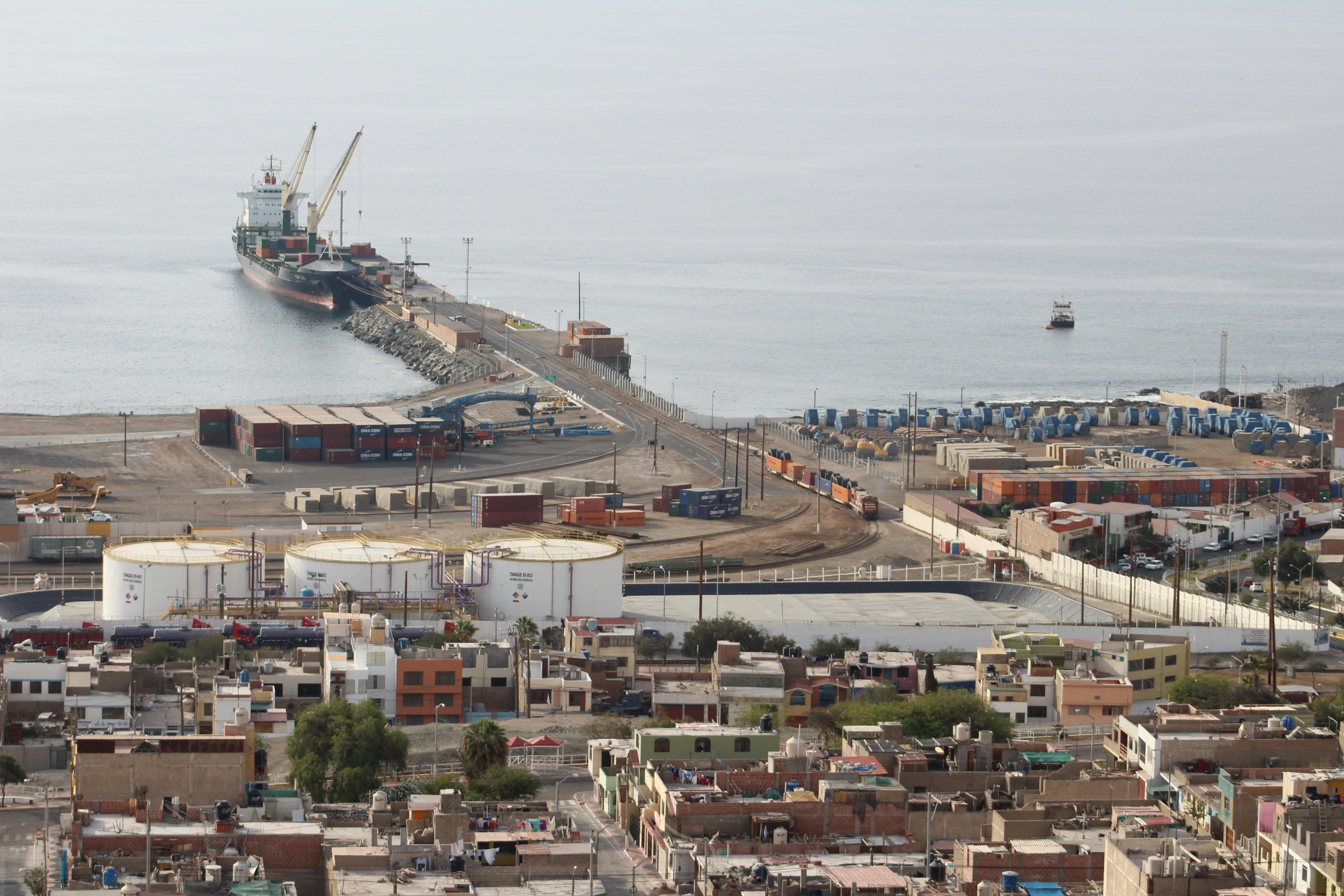 white and blue ship on dock during daytime