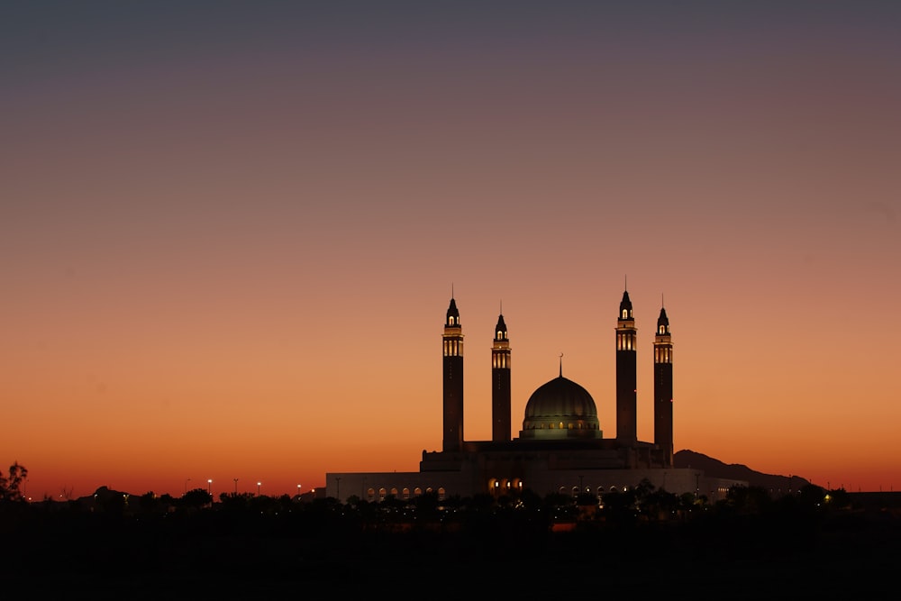 silhouette of building during sunset