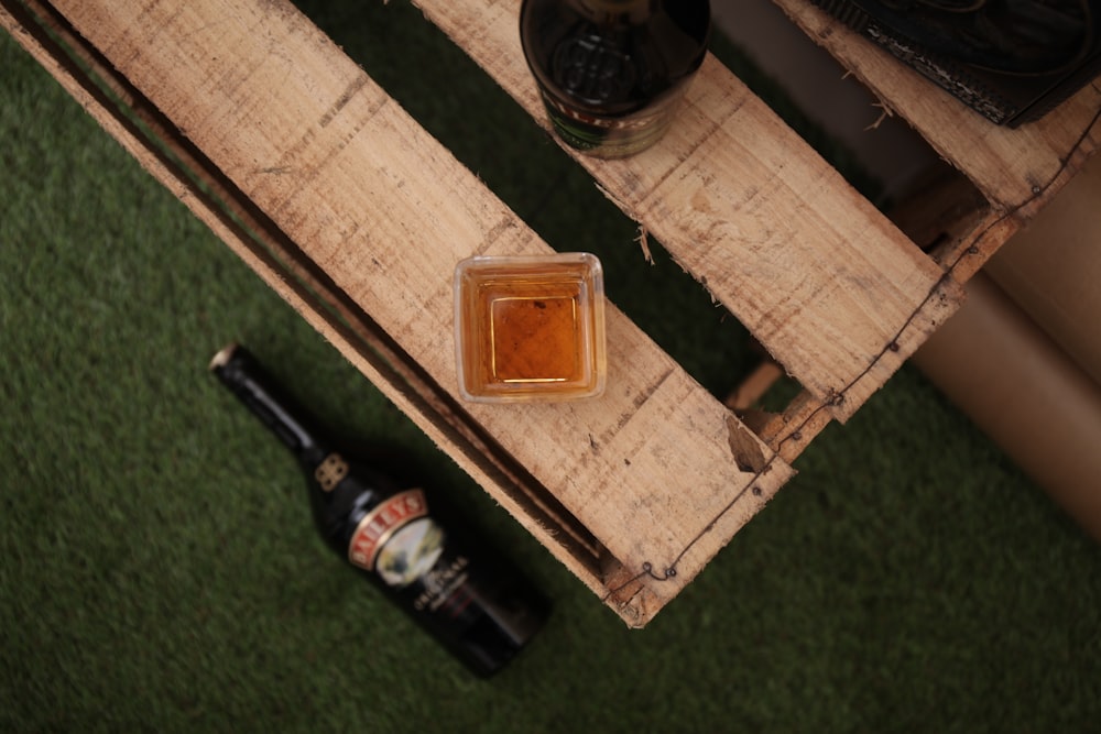 brown wooden box with bottles