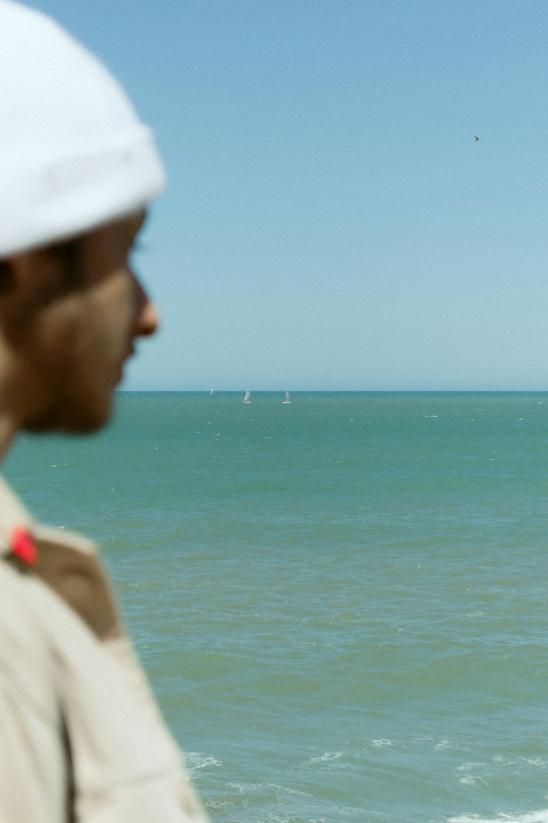 woman in white cap and white shirt