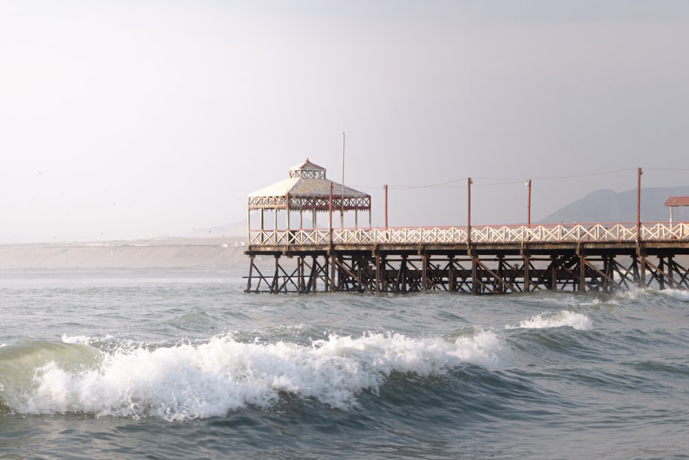 brown wooden dock on sea during daytime