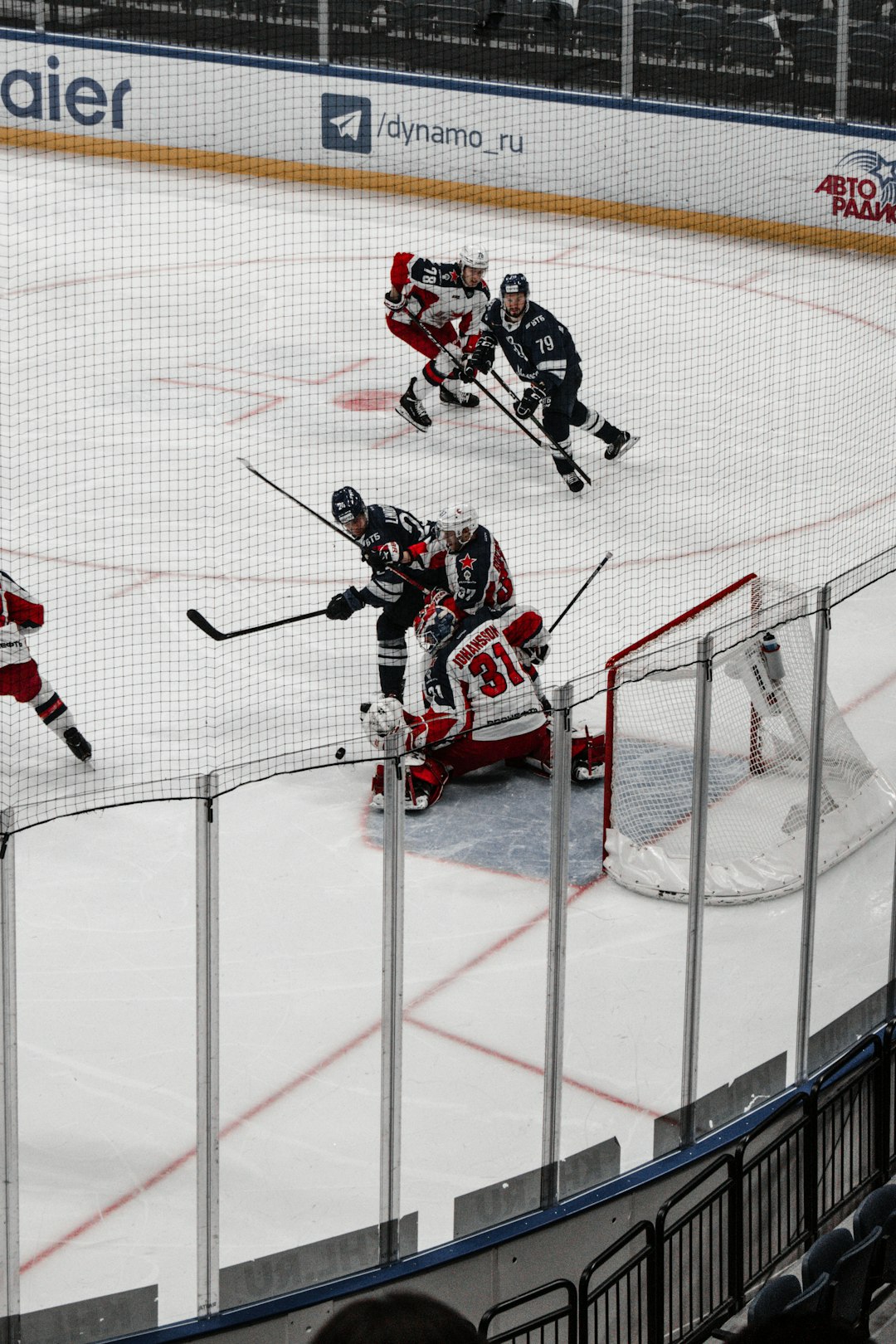 man in red and white ice hockey jersey playing ice hockey