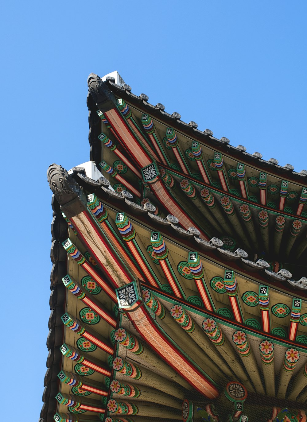 red and black roof under blue sky during daytime