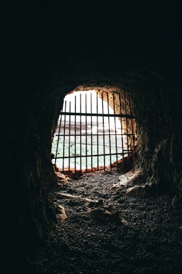 brown cave with black metal frame