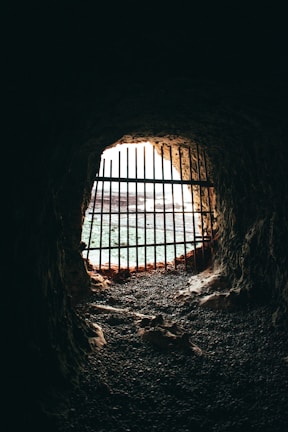 brown cave with black metal frame