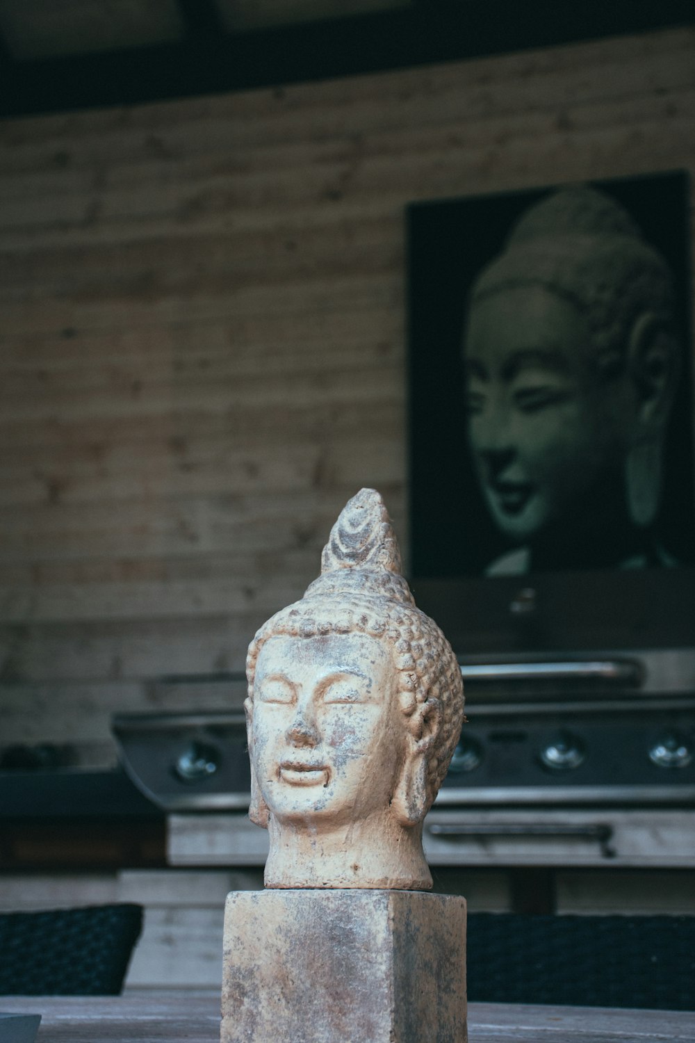 brown ceramic buddha figurine on black table