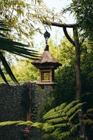 brown wooden hanging bird cage