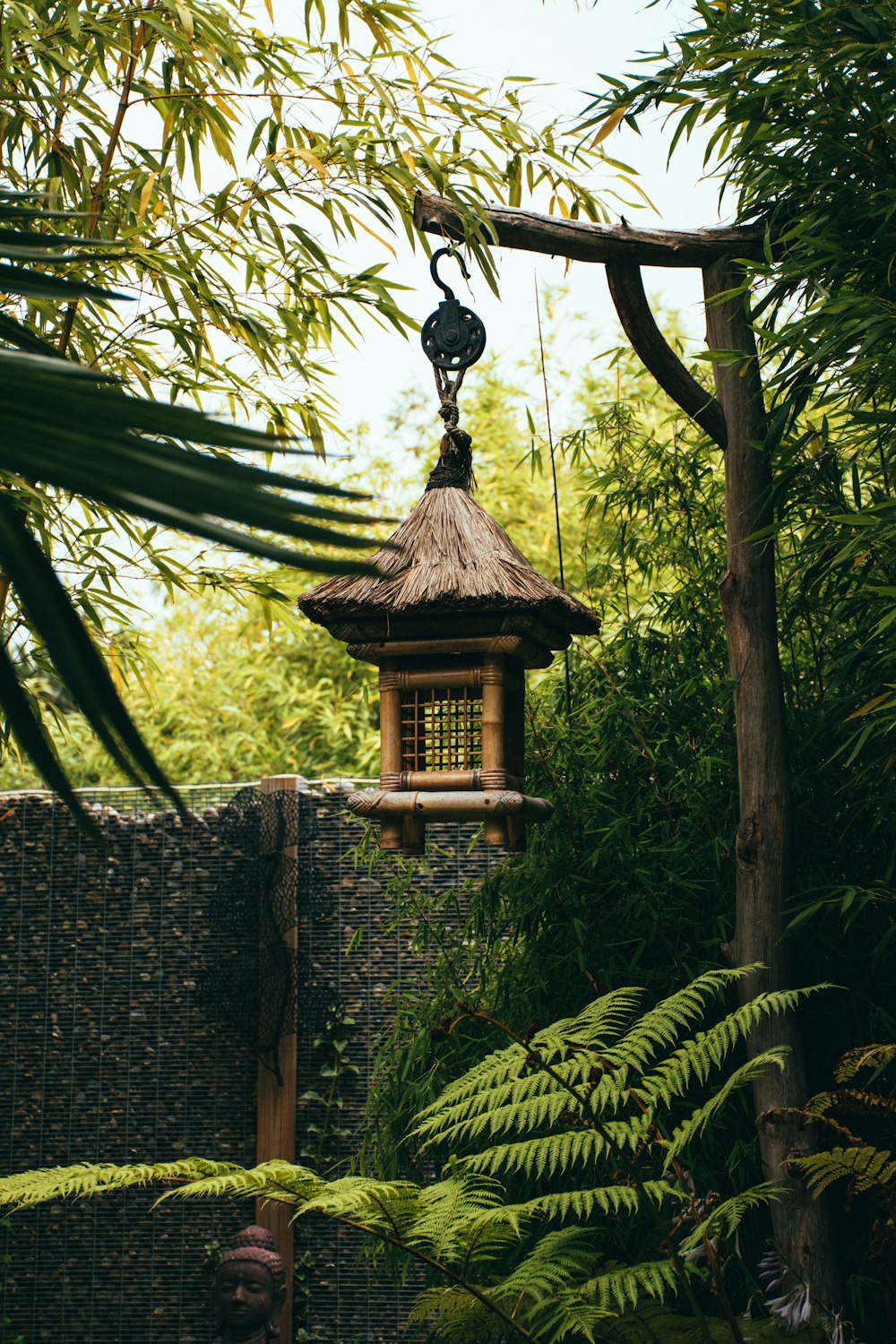 brown wooden hanging bird cage