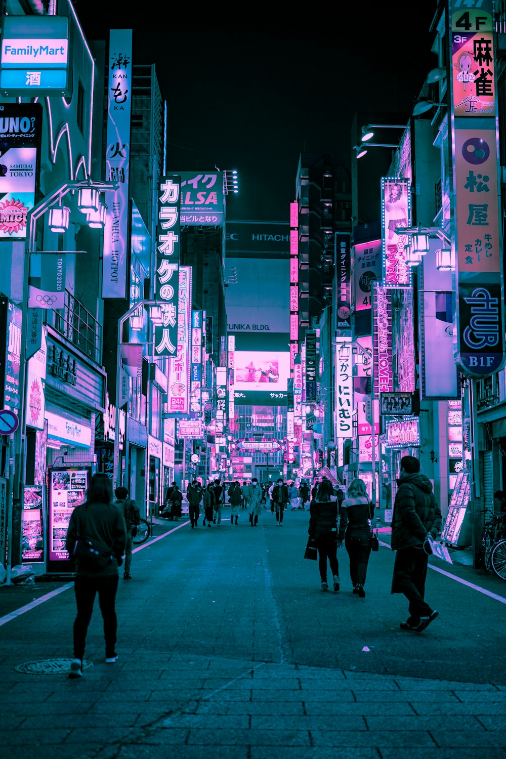 people walking on street during night time